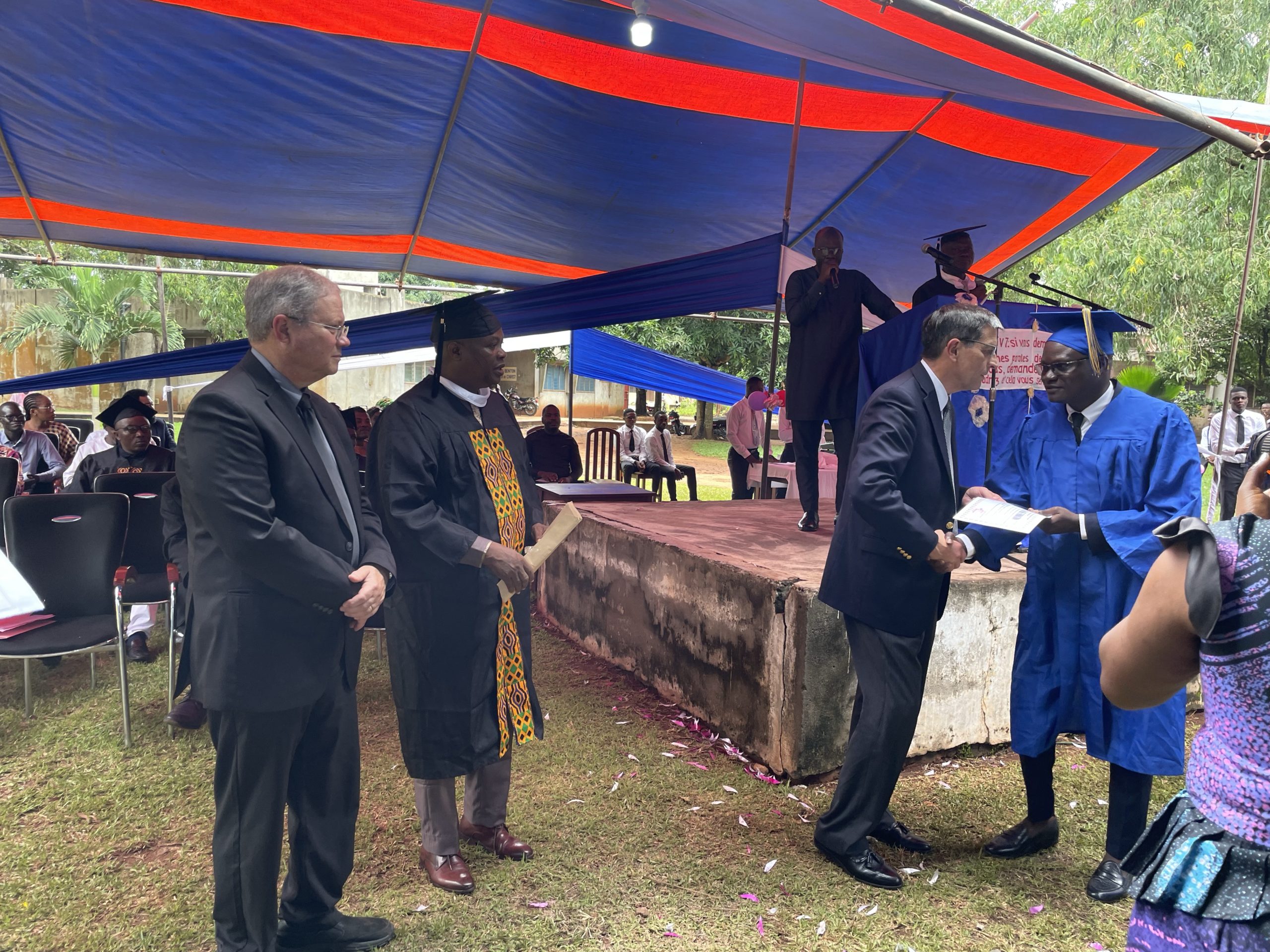 Paul Johnson presents diplomas at graduation